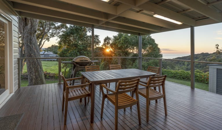 The deck of Baileys Cottage with table and chairs in Glenrock State Conservation Area. Photo: john Spencer &copy; DPIE