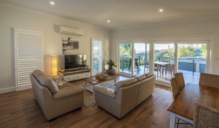 The lounge and dining room in Baileys Cottage, Glenrock State Conservation Area. Photo: John Spencer &copy; DPIE