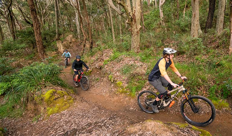 3 cyclists on Glenrock mountain biking trails. Photo: John Spencer &copy; DPE