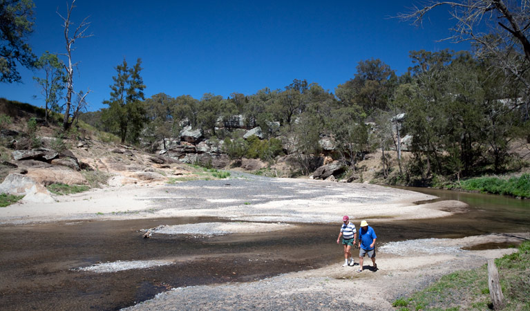 Two men walk along the Goulburn River at Big River campground, Goulburn River National Park. Photo: Nick Cubbin &copy; DPIE