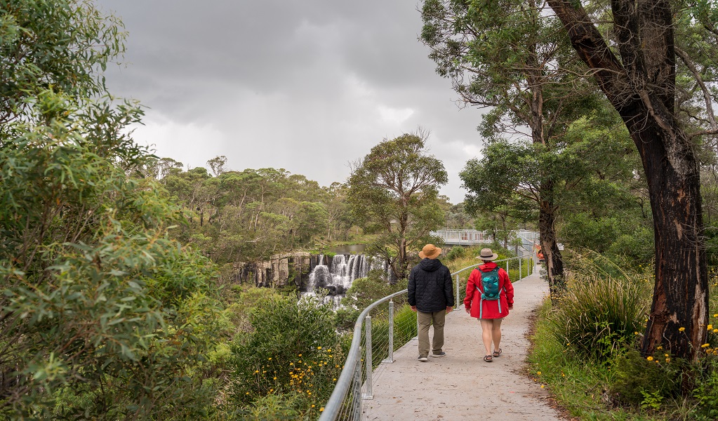 Visitors walking along the platform towards Upper Falls, Guy Fawkes River National Park. Photo: David Waugh &copy; DCCEEW