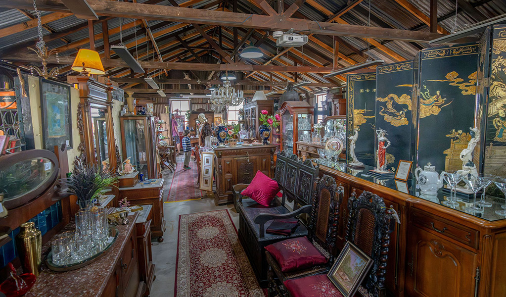 A large selection of antiques on display at Gold Rush Antiques in Hartley Historic Site. Credit: John Spencer &copy; DCCEEW