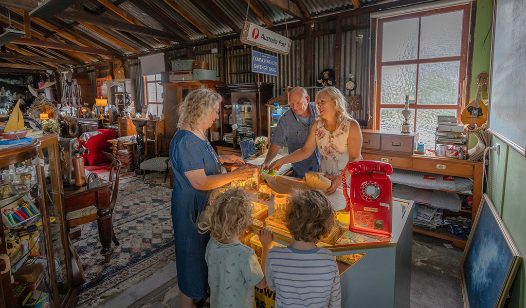 Shoppers at the counter of Gold Rush Antiques, Hartley Historic Site. Credit: John Spencer &copy; DCCEEW