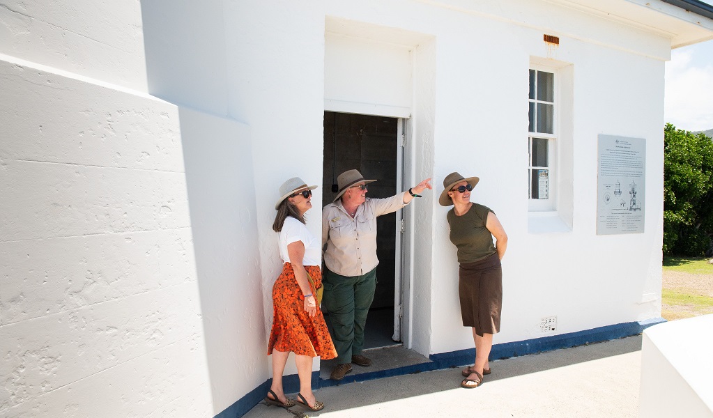 Visitors being met by an NPWS guide at the door of Smoky Cape Lighthouse, Hat Head National Park. Photo: Louise Walpole/DCCEEW &copy; DCCEEW
