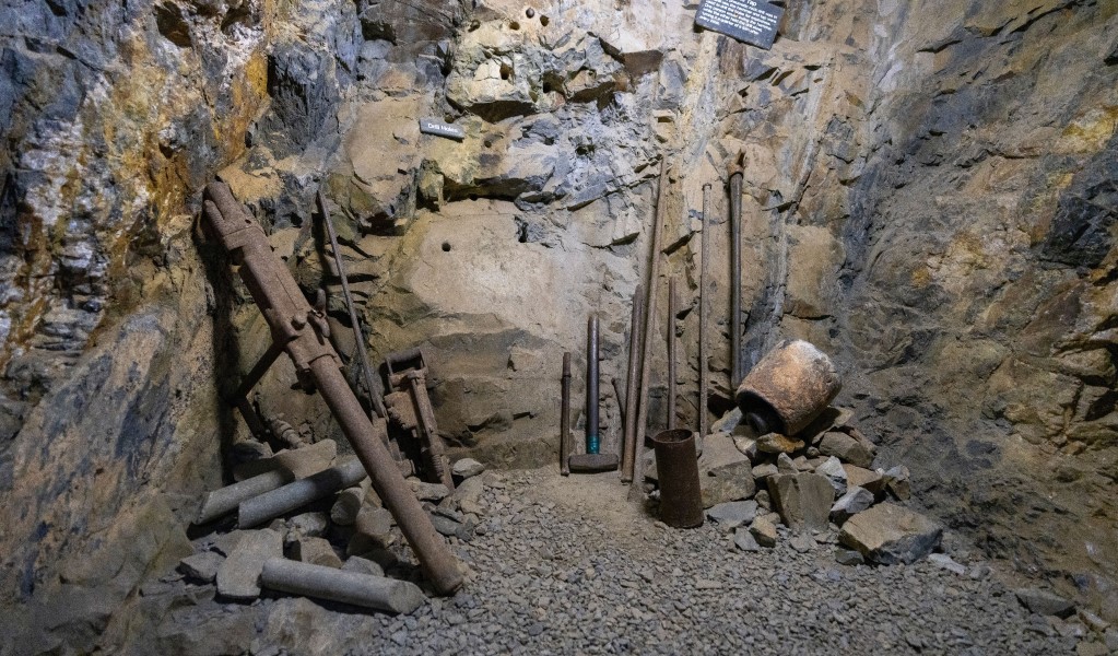 Historic mining tools set against the rugged walls inside Bald Hill tourist mine. Photo: John Spencer/DCCEEW © DCCEEW