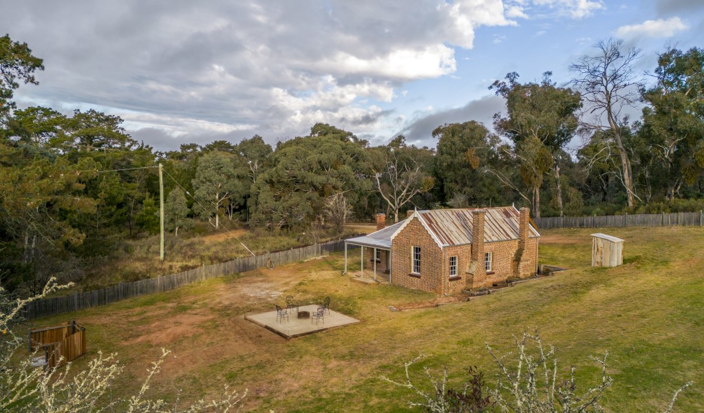 The exterior of Fairfax House, surrounded by trees in Hill End Historic Site. Photo: John Spencer &copy; DPE