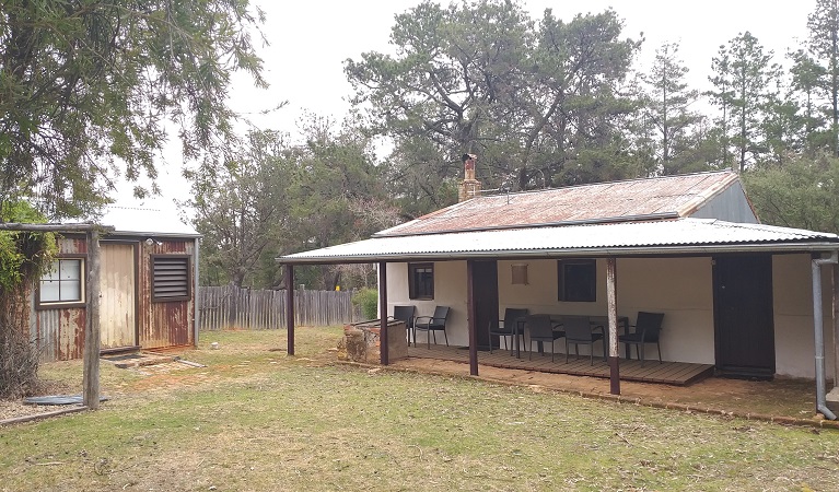 Verandah and outdoor seating at Hill End Pines Cottage, Hill End Historic Site. Photo: Brett Kearins/DPIE