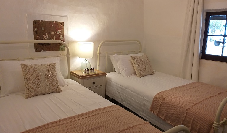 Bedroom with 2 single beds at Hill End Pines Cottage, Hill End Historic Site. Photo: Brett Kearins/DPIE