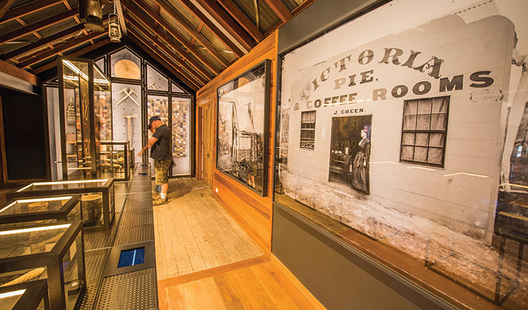 A visitor looks at displays in Hill End Heritage Centre. Photo: John Spencer/OEH.