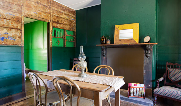 The dining room with dining table and 4 chairs at Sydney Hotel Cottage in Hill End Historic Site. Photo: Steve Garland &copy; DPIE