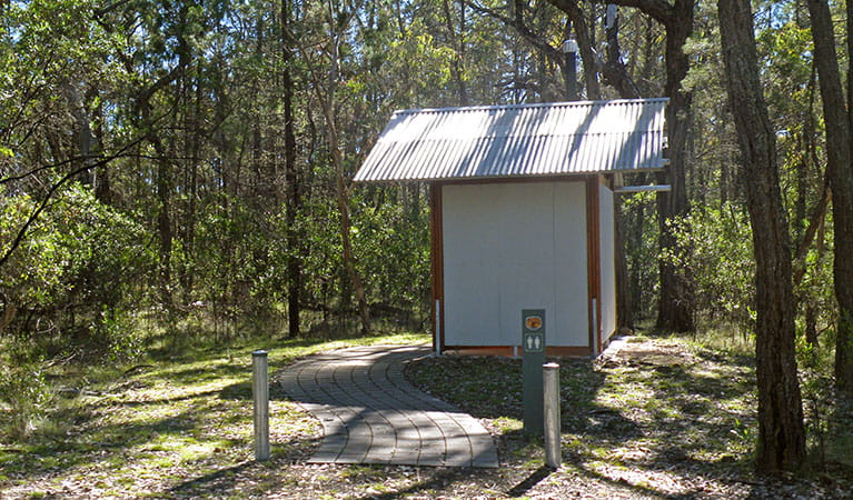 View of paved path to toilet facilities surrounded by bushland, in Horton Falls National Park. Photo: Peter Croft &copy; DPIE