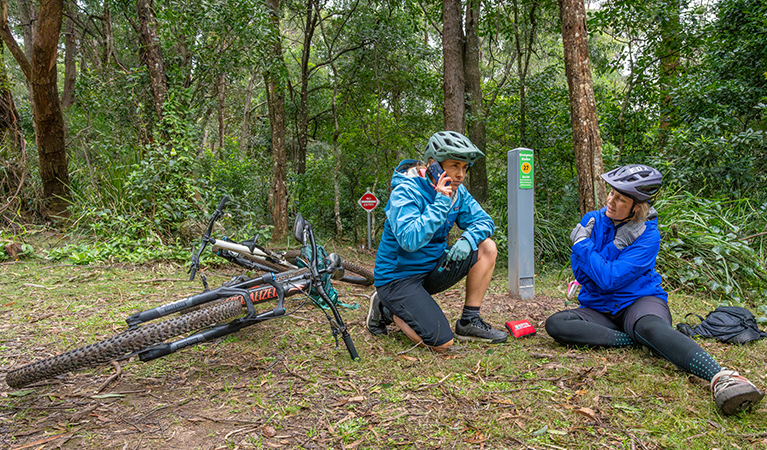 Two women call for help. The unique ID on the marker helps emergency services find them. Credit: John Spencer © DCCEEW