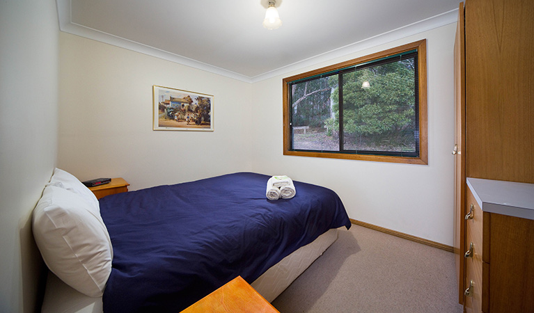 Bedroom with lookout to bushland at Binda Bush cabins, Jenolan Karst Conservation Reserve. Photo: Keith Maxwell, A Shot Above Photography &copy; Keith Maxwell