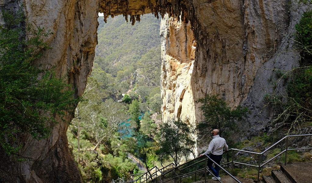 A walker descends the stairs to Carlotta Arch in Jenolan Karst Conservation Reserve. Photo: Elinor Sheargold &copy; DPE