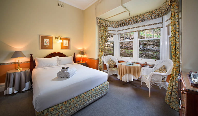 Queen guestroom with bay window at Jenolan Caves House, Jenolan Karst Conservation Reserve. Photo: Keith Maxwell, A Shot Above Photography