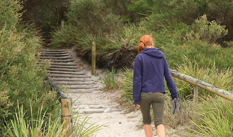A woman walks toward steps at Red Point, Jervis Bay National Park. Photo: Andrew Richards &copy; Andrew Richards