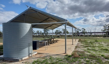 Covered picnic area with Ita Lake in the distance, Kalyarr National Park. Photo: Mitchell Fosdick &copy; DPE