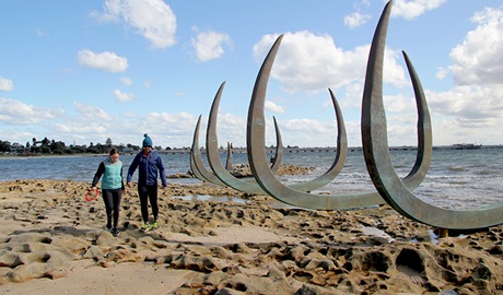 Family walking near whale bones sculptures on foreshore of Burrawang walk. Photo credit: Natasha Webb &copy; Natasha Webb