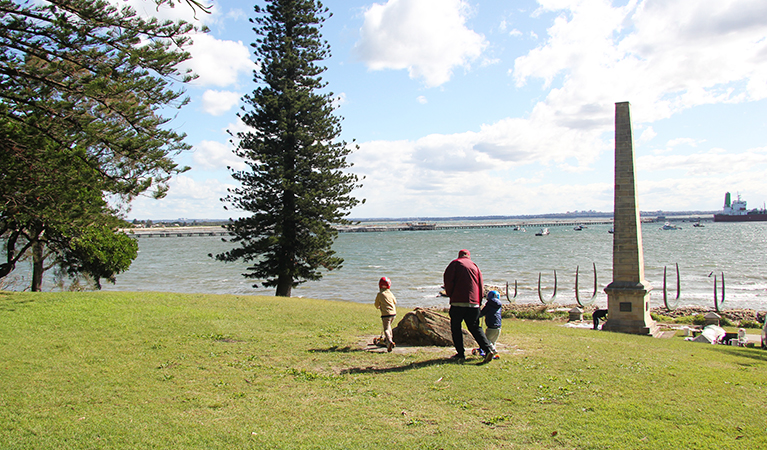 Family walking on the hill above the Captain Cook Monument. Photo credit: Natasha Webb &copy; DPIE