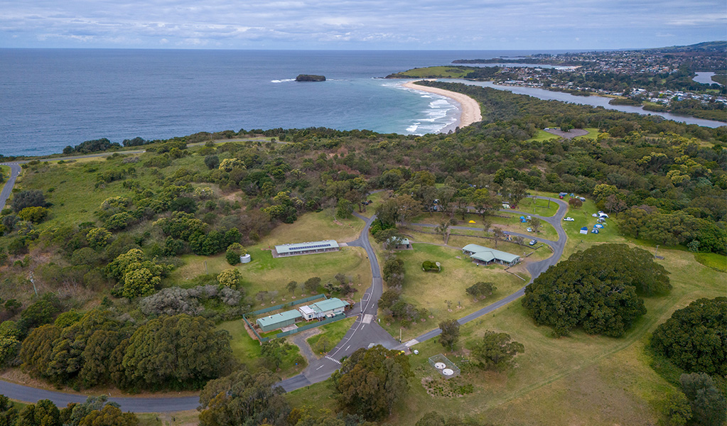Aerial view of Killalea campground with Minnamurra Beach in the distance. Photo: John Spencer/DCCEEW &copy; DCCEEW