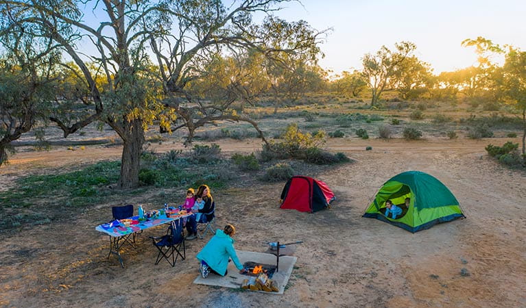 Family with young kids camping at Emu Lake campground in Kinchega National Park. Photo: John Spencer/DPIE