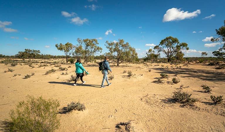 2 walkers on the Kinchega Homestead billabong walk. Photo: John Spencer &copy; OEH