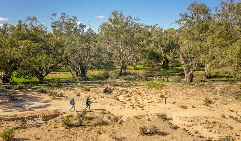 Aerial view of 2 walkers on the Kinchega Homestead billabong walk. Photo: John Spencer/DPIE