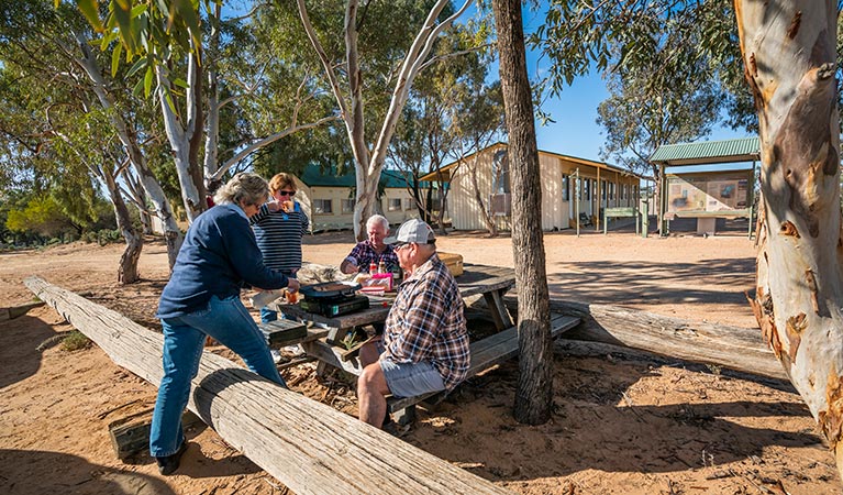 Visitors having a picnic lunch outside Kinchega Shearers Quarters. Photo: John Spencer/DPIE