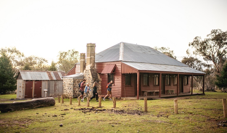 Visitors walking to The Pines Cottage, Kosciuszko National Park. Photo: Rob Mulally/DPIE