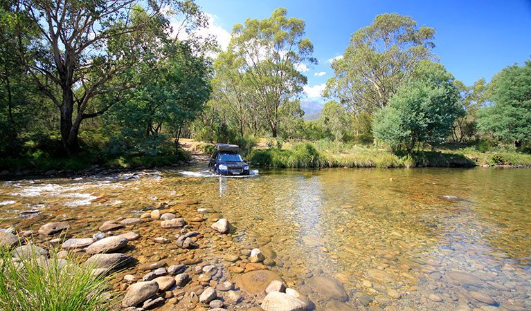 A 4WD crosses the Swampy Plain River in Geehi, Kosciuszko National Park. Photo: Elinor Sheargold/OEH