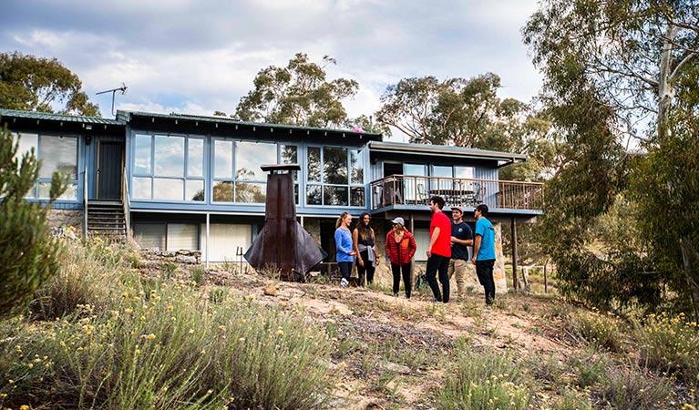 A group of friends outside Creel Lodge, Kosciuszko National Park. Photo: Boen Ferguson/OEH.