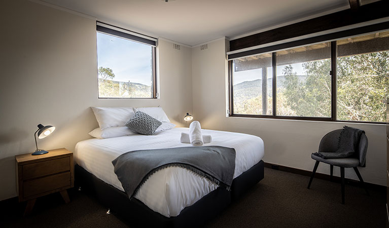 A bedroom with king bed in Creel Lodge, Kosciuszko National Park. Photo: &copy; Murray Vanderveer