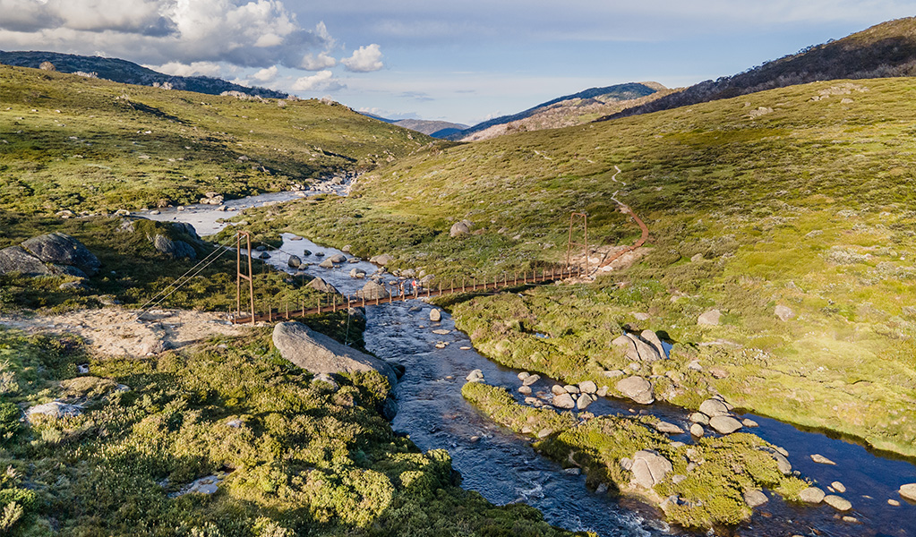 Spencers Creek bridge on Guthega to Charlotte Pass walk, in Kosciuszko National Park. Photo credit: Boen Ferguson &copy; DPIE