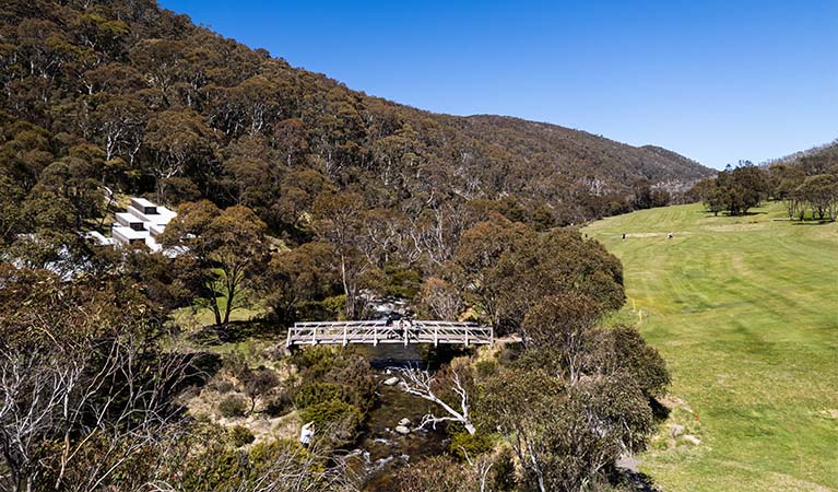 View of a bridge over Thredbo River, beside Thredbo golf course. Photo: Johnny Mellowes &copy; Johnny Mellowes/DPE