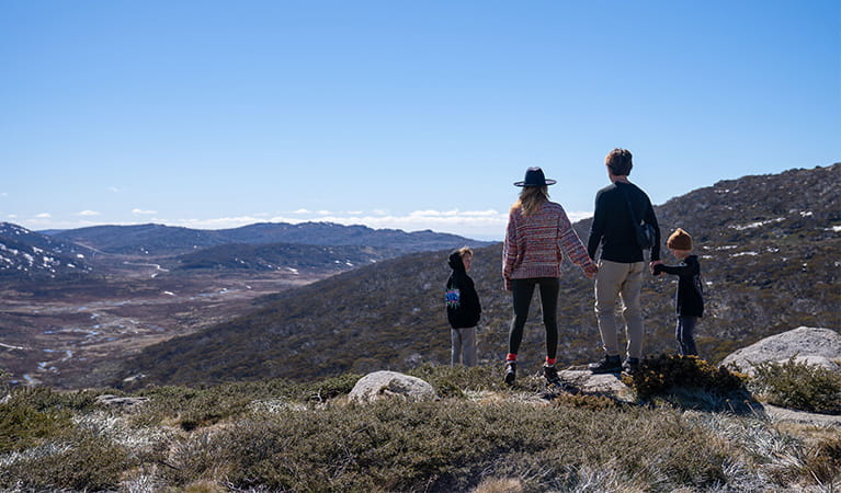 A family take in the view of Kosciuszko National Park from Mount Stilwell walk. Photo &copy; Johnny Mellowes