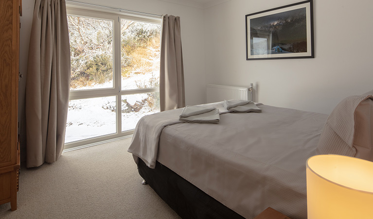 Queen bedroom in Numbananga Lodge, Kosciuszko National Park. Photo: Murray Vanderveer/OEH