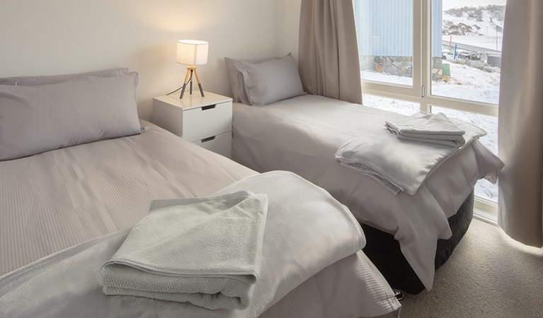 Twin beds in room at Numbananga Lodge, Kosciuszko National Park. Photo: Murray Vanderveer/OEH