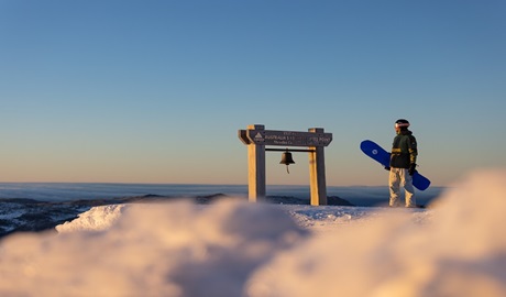 Skier atop Thredbo's highest lift point at sunrise, Kosciuszko National Park. Photo: Thredbo Resort