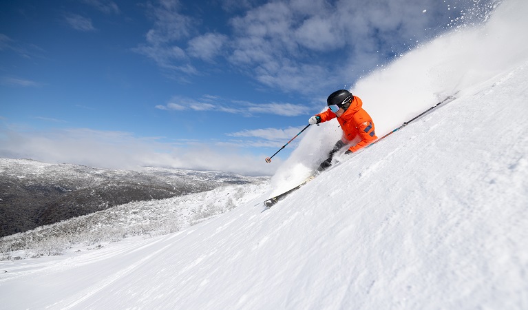 Skier descending slopes at Thredbo, Kosciuszko National Park. Photo: Thredbo Resort