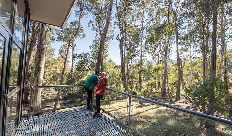 A couple on the verandah at Lyrebird Cottage, Kosciuszko National Park. Photo: Boen Ferguson/OEH.