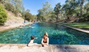 Visitors swim in the thermal pool, Yarrangobilly area of Kosciuszko National Park. Photo: Boen Ferguson/OEH.