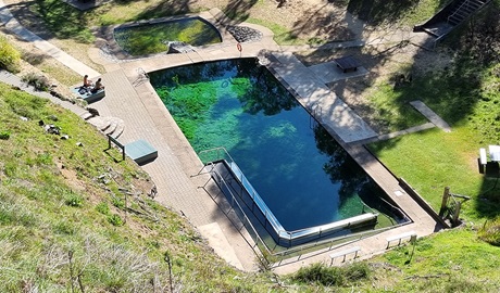 Looking down at Yarrangobilly Caves thermal pool and picnic area from Yarrangobilly Caves thermal pool walk. Credit: Paul Sims &copy; DCCEEW