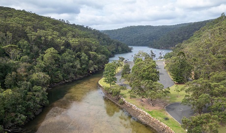 An aerial photo of Apple Tree picnic area surrounded by Apple Tree Creek, Cowan Creek and Ku-ring-gai Chase National Park bushland. Credit: John Spencer &copy; DCCEEW