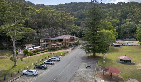 Bobbin Head Visitor Centre and the scenic rocky cliff and rainforest surrounds in Ku-ring-gai Chase National Park. Photo: John Spencer &copy; DCCEEW