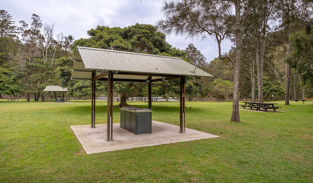 Sheltered barbecues and open picnic tables at The Basin campground. Credit: John Spencer/DCCEEW &copy; DCCEEW