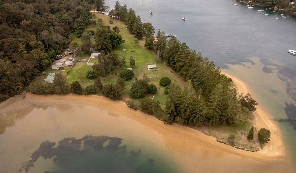 Aerial view of The Basin campground surrounded by The Basin lagoon. Credit: John Spencer/DCCEEW  &copy; DCCEEW
