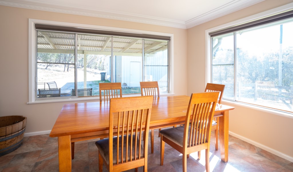 A dining table and chairs at Lavender Vale Cottage in Kwiambal National Park. Photo &copy; DPE