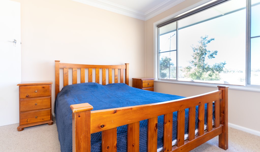 A bedroom with queen bed at Lavender Vale Cottage in Kwiambal National Park. Photo &copy; DPE