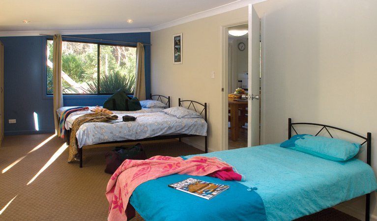 Bedroom area, Plomer Beach House, Limeburners Creek National Park. Photo: Michael van Ewijk/OEH