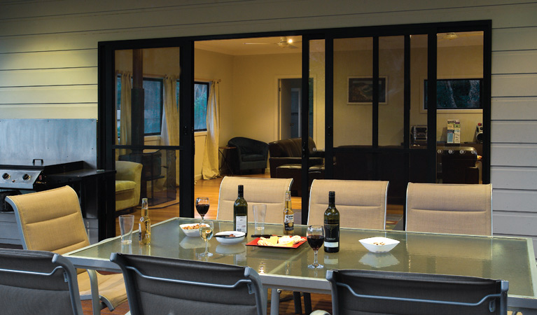 The outdoor dining area, Plomer Beach House, Limeburners Creek National Park. Photo: Michael van Ewijk/OEH